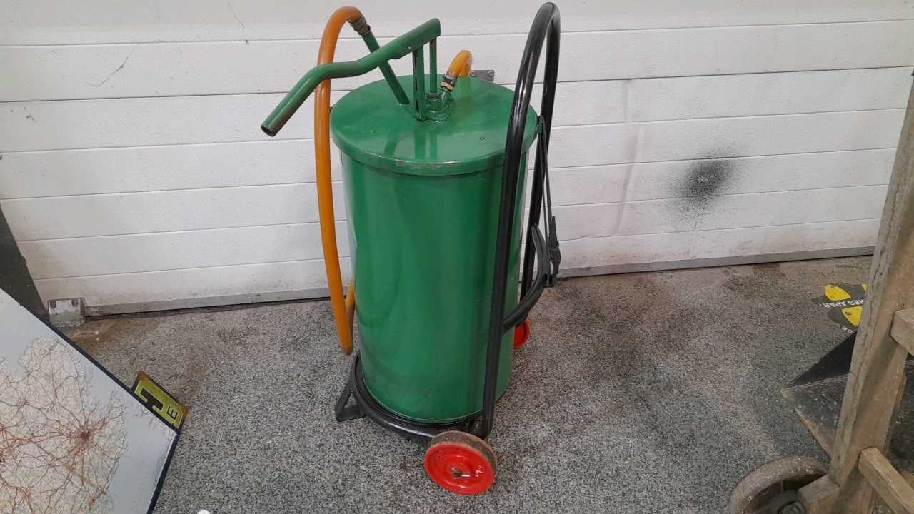 Lot 539 - 55 LITRE OIL DISPENCER CAST TROLLEY