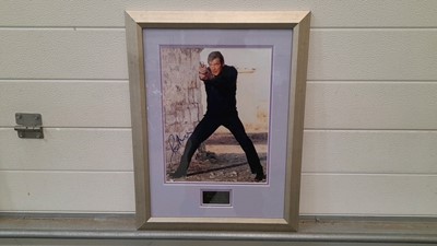 Lot 599 - FRAMED SIGNED PHOTO OF ROGER MOORE AS JAMES BOND 21"X17"