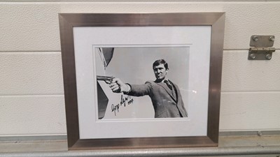 Lot 611 - FRAMED PHOTO SIGNED BY GEORGE LAZENBY AS JAMES BOND 16"X14"