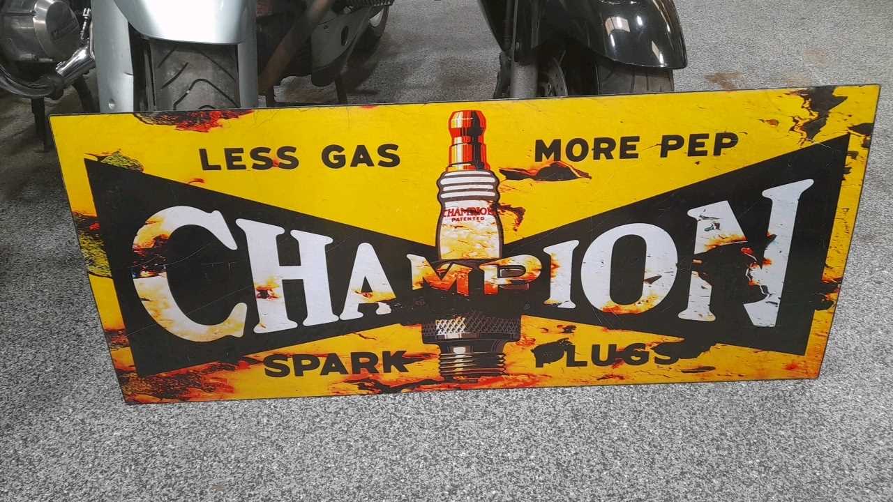 Lot 29 - LESS GAS ,MORE PEP, CHAMPION SPARK PLUG METAL REPRO SIGN 47" X 20"