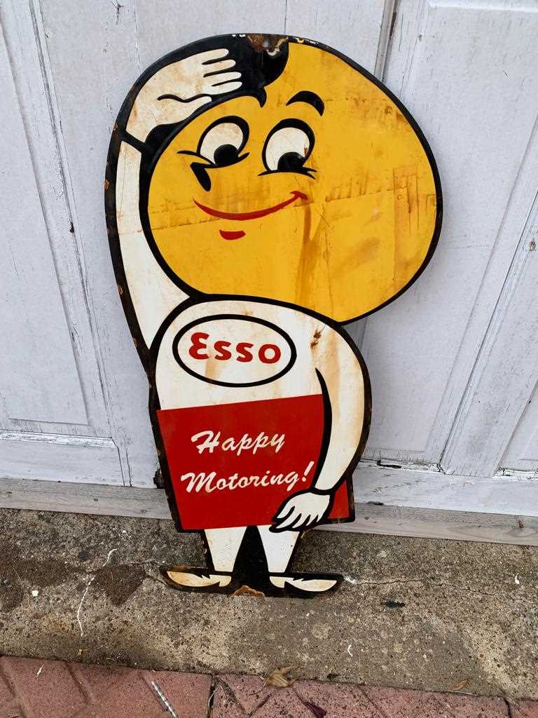 Lot 65 - ESSO HAPPY MOTORING MAN ENAMEL SIGN 15" X 32"