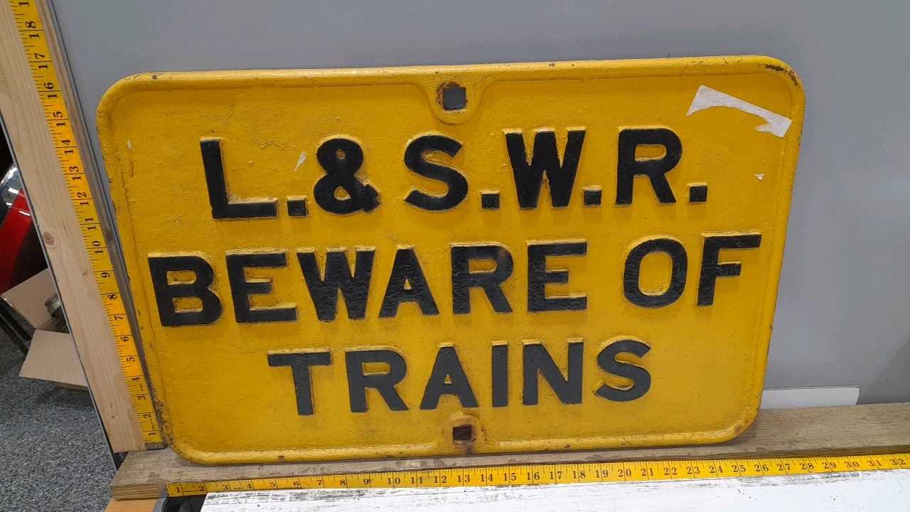 Lot 47 - L & S.W.R BEWARE OF THE TRAINS CAST IRON SIGN