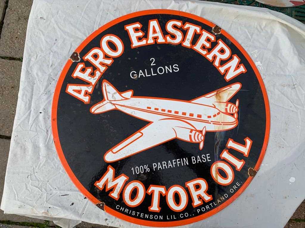 Click for high resolution Lot 231 - AERO EASTERN MOTOR OIL ENAMEL SIGN 24" DIA