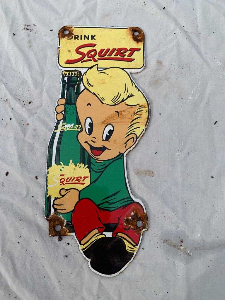 Lot 375 - SQUIRT POP ENAMAL SIGN BOY  10" X 4"