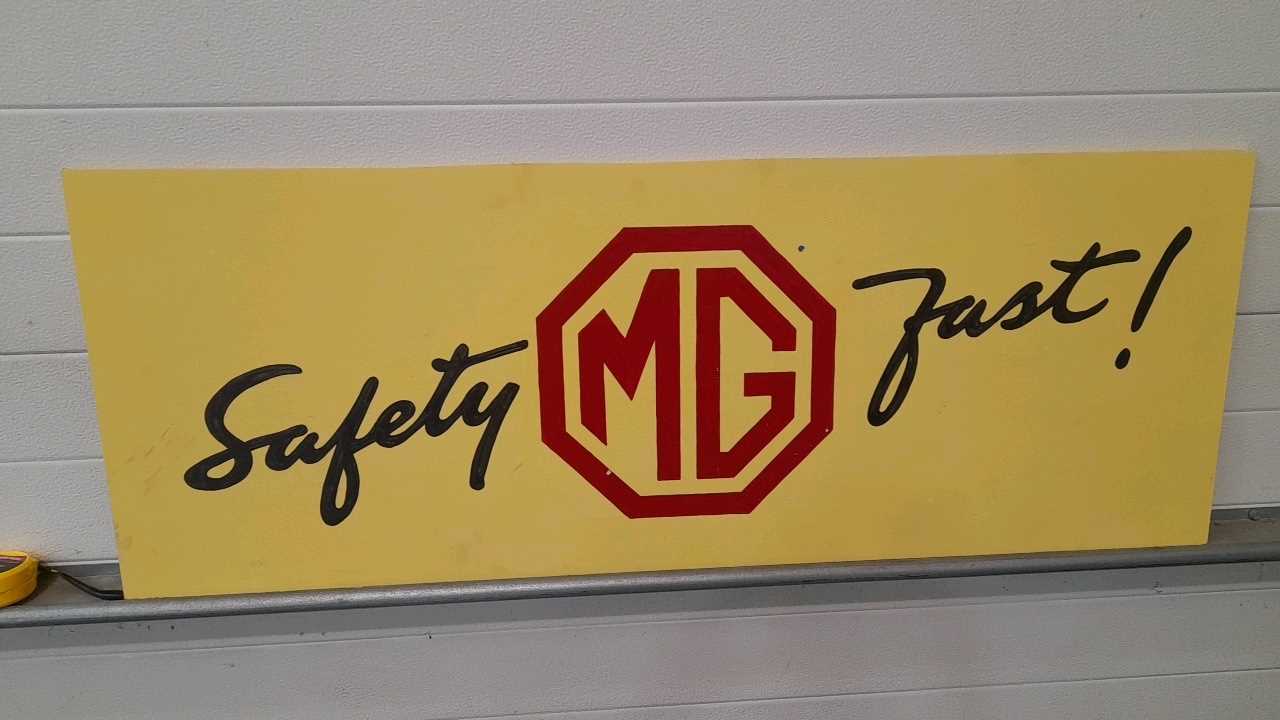 Lot 298 - HAND PAINTED WOODEN M.G SAFETY FAST SIGN 48