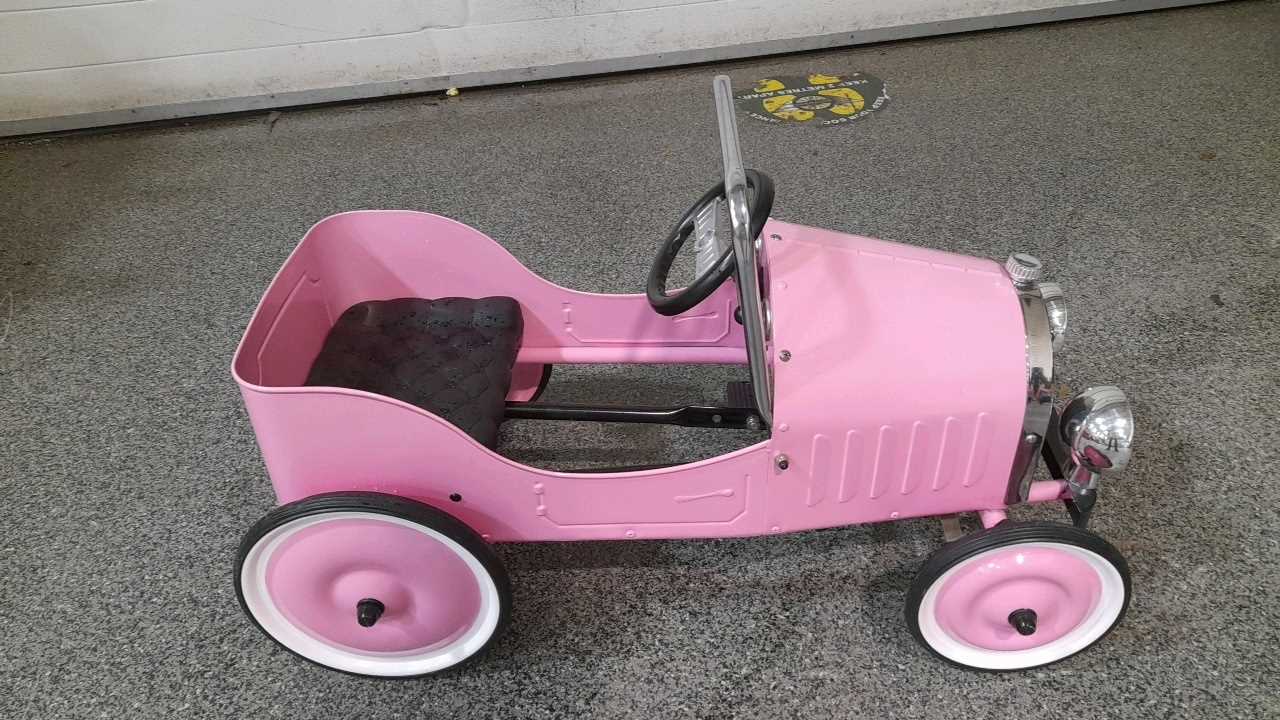 Pink metal pedal car online