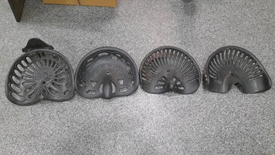 Lot 294 - SET OF 4 CAST IRON TRACTOR SEATS