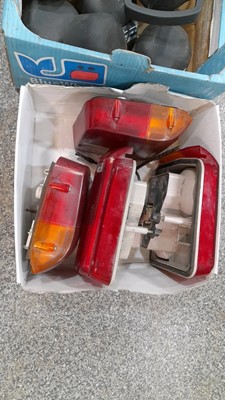 Lot 52 - 2 BOXES OF FRONT WORK LIGHTS AND REAR TAIL LIGHTS + SMALL PLASTIC MICHELIN MAN