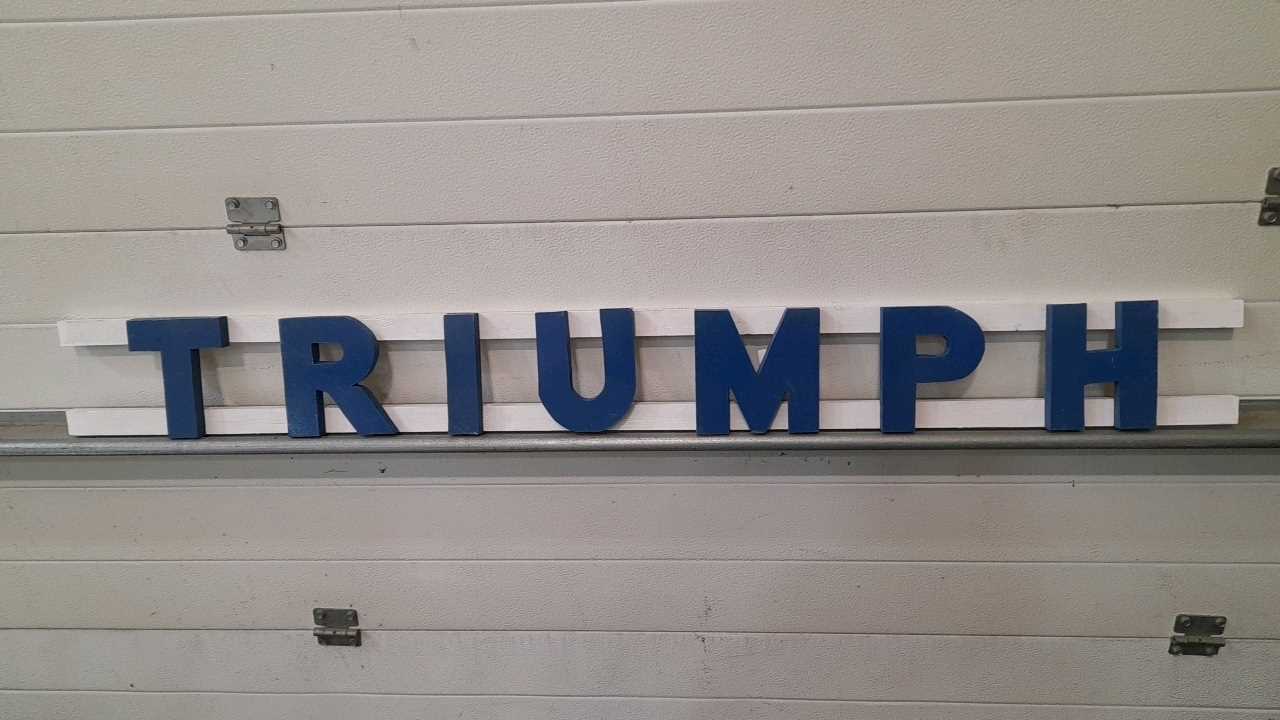 Lot 22 - WOODEN HAND PAINTED TRIUMPH LETTERS 57