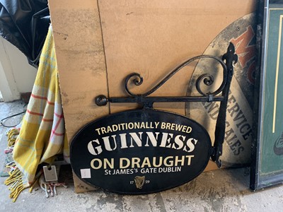 Lot 261 - CAST METAL BRACKET WITH DOUBLE SIDED GUINNESS...