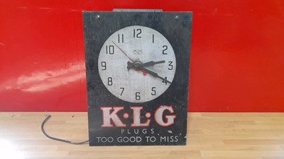 Lot 351 - K.L.G PLUGS TOO GOOD TO MISS ELECTRIC CLOCK 14" X 10"