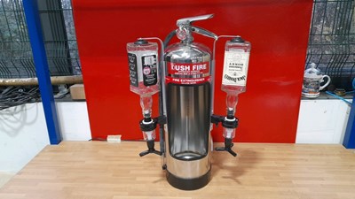 Lot 679 - CHROME FIRE EXTINGUISHER WITH 2 OPTICS 24" X 15"