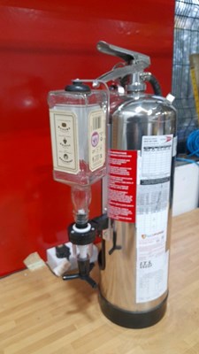 Lot 679 - CHROME FIRE EXTINGUISHER WITH 2 OPTICS 24" X 15"