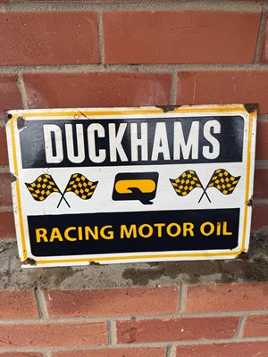 Lot 653 - DUCKHAMS RACING MOTOR OIL ENAMEL SIGN 15" X 10"