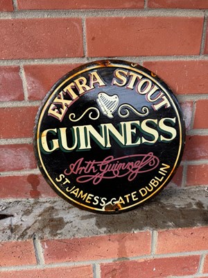 Lot 733 - GUINNESS EXTRA STOUT ENAMEL SIGN 12" DIA