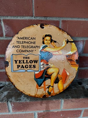 Lot 145 - THE YELLOW PAGES ENAMEL SIGN 12" DIA