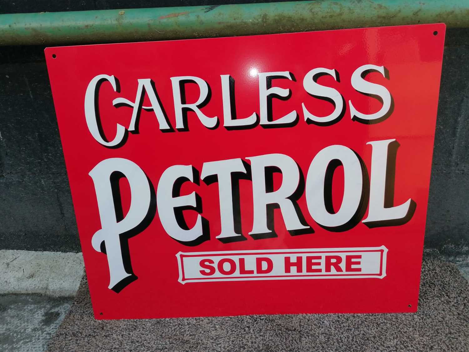 Click for high resolution Lot 105 - CARLESS PETROL SOLD HERE SIGN 22" X 18"