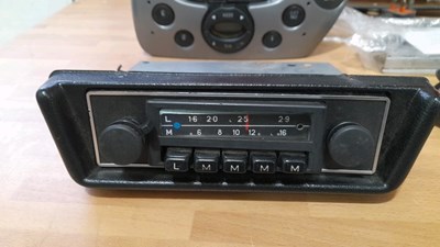Lot 877 - SELECTION OF CAR BULBS , CAR RADIOS , SWITCHED & A OUTSIDE SEARCHLIGHT