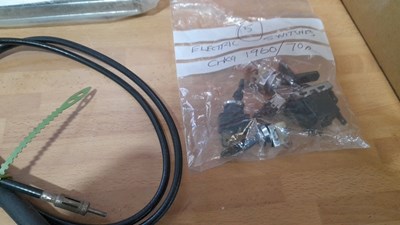 Lot 877 - SELECTION OF CAR BULBS , CAR RADIOS , SWITCHED & A OUTSIDE SEARCHLIGHT