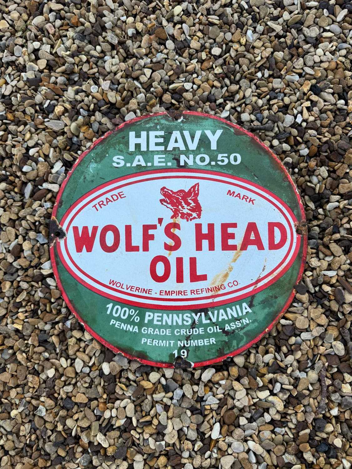 Lot 457 - WOLF'S HEAD OIL ENAMEL SIGN 12" DIA
