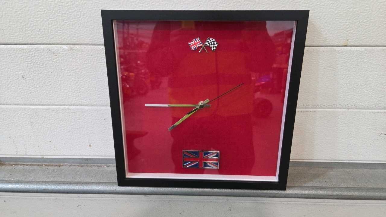 Lot 809 - TRIUMPH RED WALL CLOCK 13" X 13"
