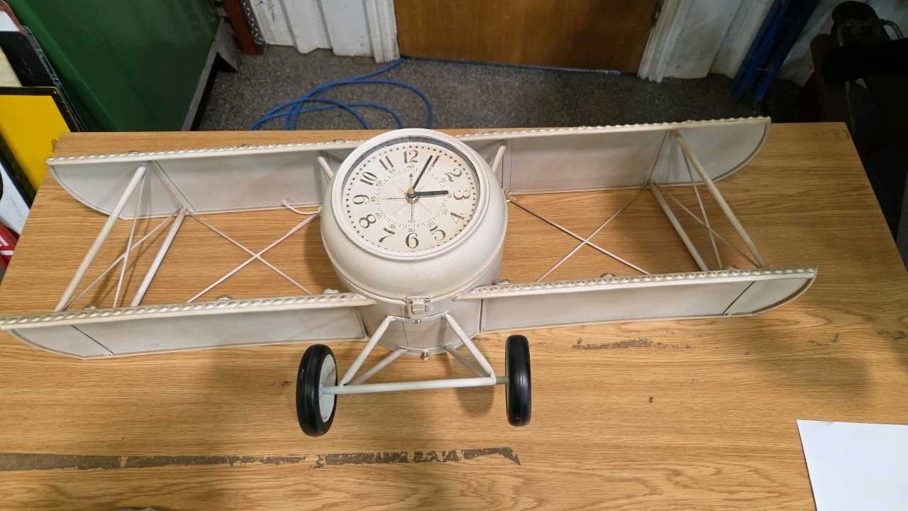 Lot 799 - BI PLANE CLOCK 36" X 14"