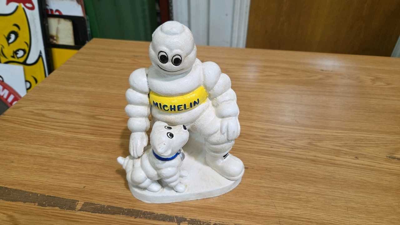 Lot 687 - CAST MICHELIN MAN & DOG 8" X 6"