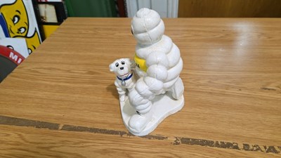 Lot 687 - CAST MICHELIN MAN & DOG 8" X 6"