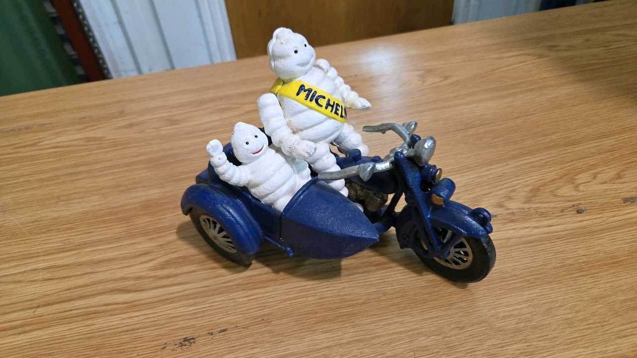 Lot 693 - CAST MICHELIN MEN ON A MOTOR BIKE & SIDECAR 8" X 6"