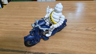 Lot 693 - CAST MICHELIN MEN ON A MOTOR BIKE & SIDECAR 8" X 6"