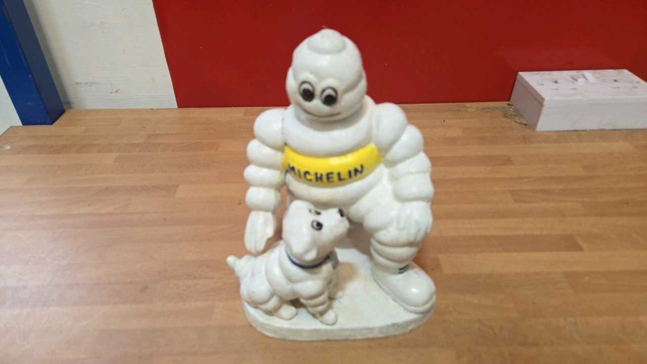 Lot 807 - CAST MICHELIN MAN & DOG 8" X 6"