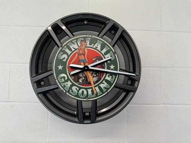 Lot 627 - PIN-UP GIRL ALLOY WHEEL CLOCK