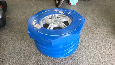 Lot 143 - CONCEPT COFFEE TABLE,IN THE FORM OF A NUT & THREAD, ROUND A PORSCHE WHEEL