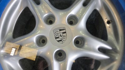 Lot 143 - CONCEPT COFFEE TABLE,IN THE FORM OF A NUT & THREAD, ROUND A PORSCHE WHEEL