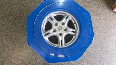 Lot 143 - CONCEPT COFFEE TABLE,IN THE FORM OF A NUT & THREAD, ROUND A PORSCHE WHEEL