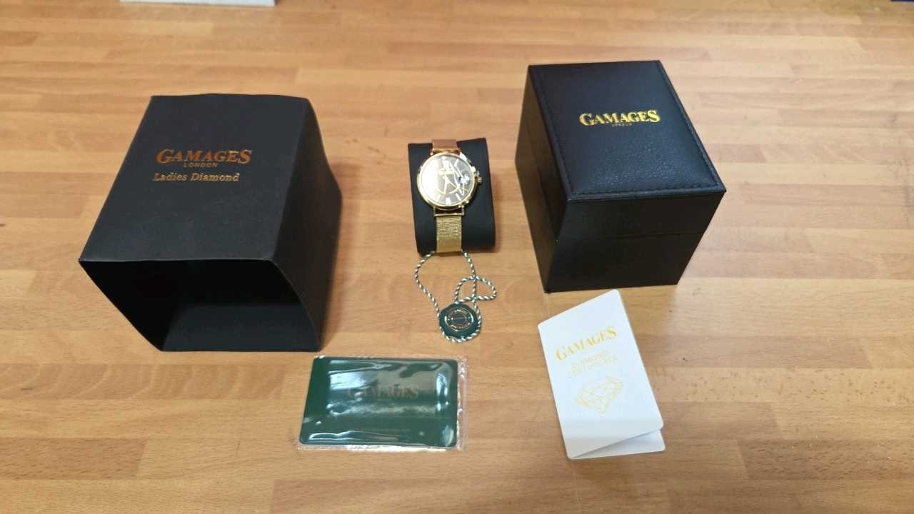 Lot 75 - GAMAGES LADIES DIAMOND 24 CARAT GOLD PLATED WATCH