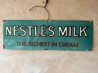 Lot 199 - NESTLE'S MILK ENAMEL SIGN 24" X 8"