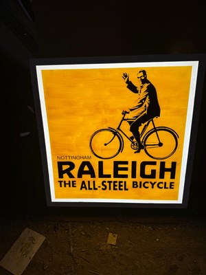 Lot 689 - RALEIGH THE ALL STEEL BICYCLE LIGHT UP SIGN 23" X 23"