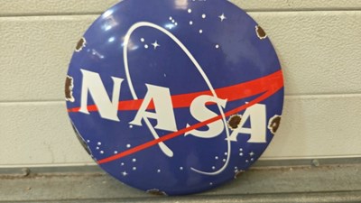 Lot 819 - NASA ENAMEL SIGN 12" DIA
