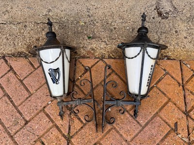 Lot 421 - PAIR OF SMALL WALL MOUNTED GUINNESS LAMPS