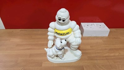 Lot 779 - CAST MICHELIN MAN WITH DOG 16" X 11"