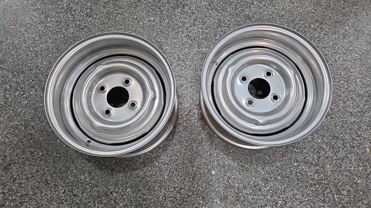 Lot 569 - PAIR OF NEW UNUSED FORD 6J 13" STEEL WHEEL RIMS