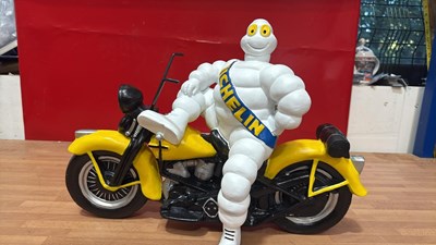 Lot 555 - MICHELIN MAN ON A MOTOR BIKE 19" TALL
