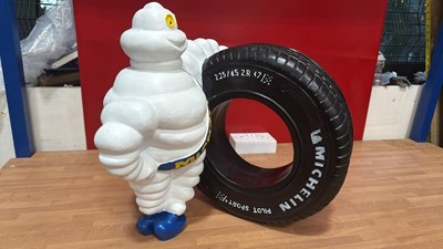 Lot 857 - MICHELIN MAN WITH A TYRE 18" TALL