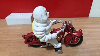 Lot 851 - CAST MICHELIN ON A MOTOR BIKE 9" TALL