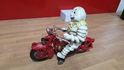 Lot 871 - CAST MICHELIN MAN ON A MOTOR BIKE