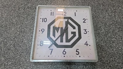 Lot 775 - LARGE METAL MG CLOCK