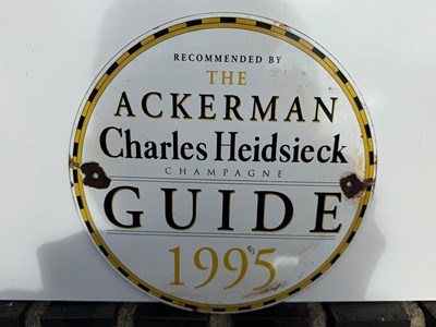 Lot 273 - THE ACKERMAN CHAMPAGNE ENAMEL SIGN 9.5 " DIA