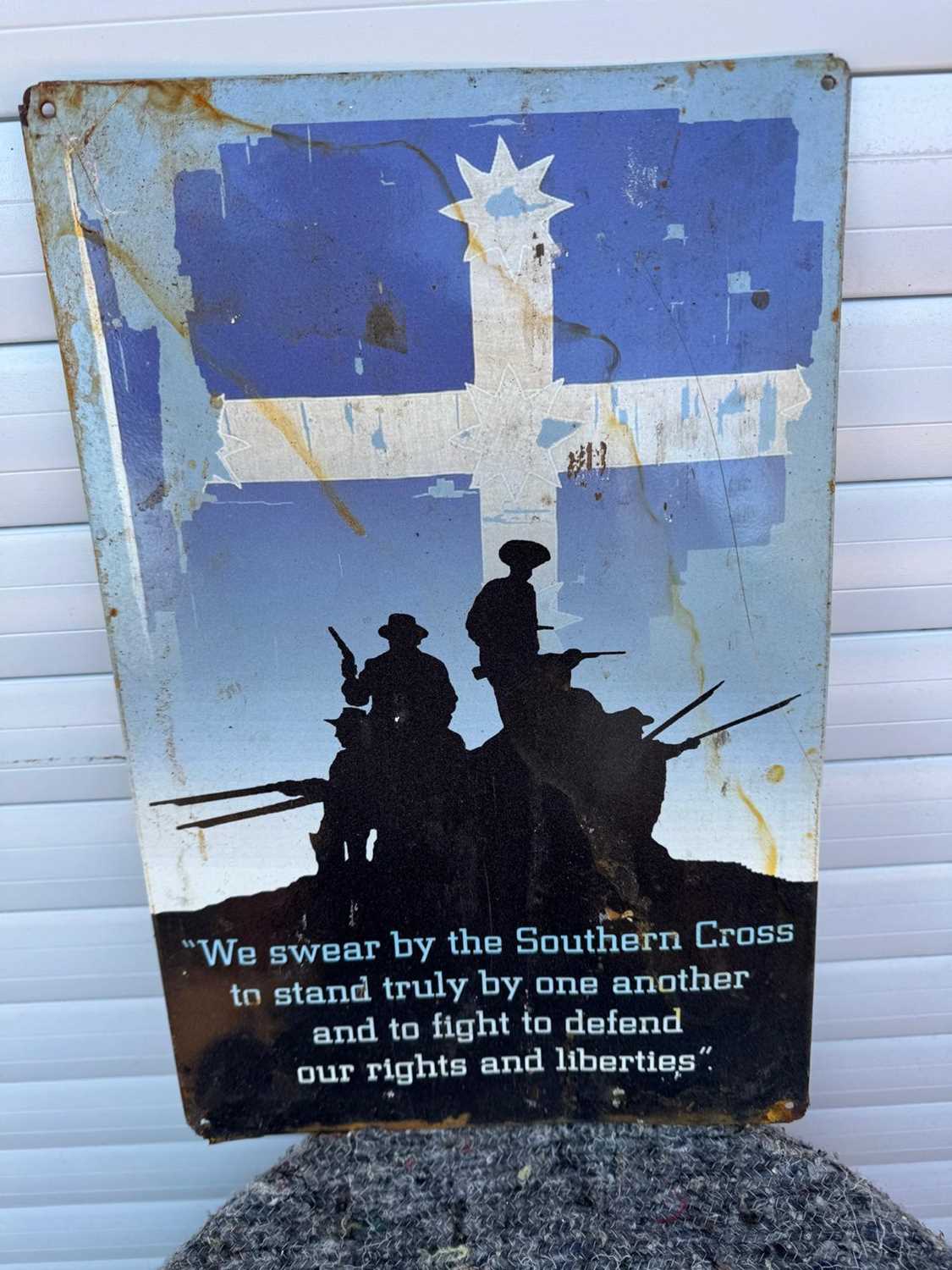 Lot 591 - WE SWEAR BY THE SOUTHERN CROSS REPRO SIGN 11.5" X 17.5"