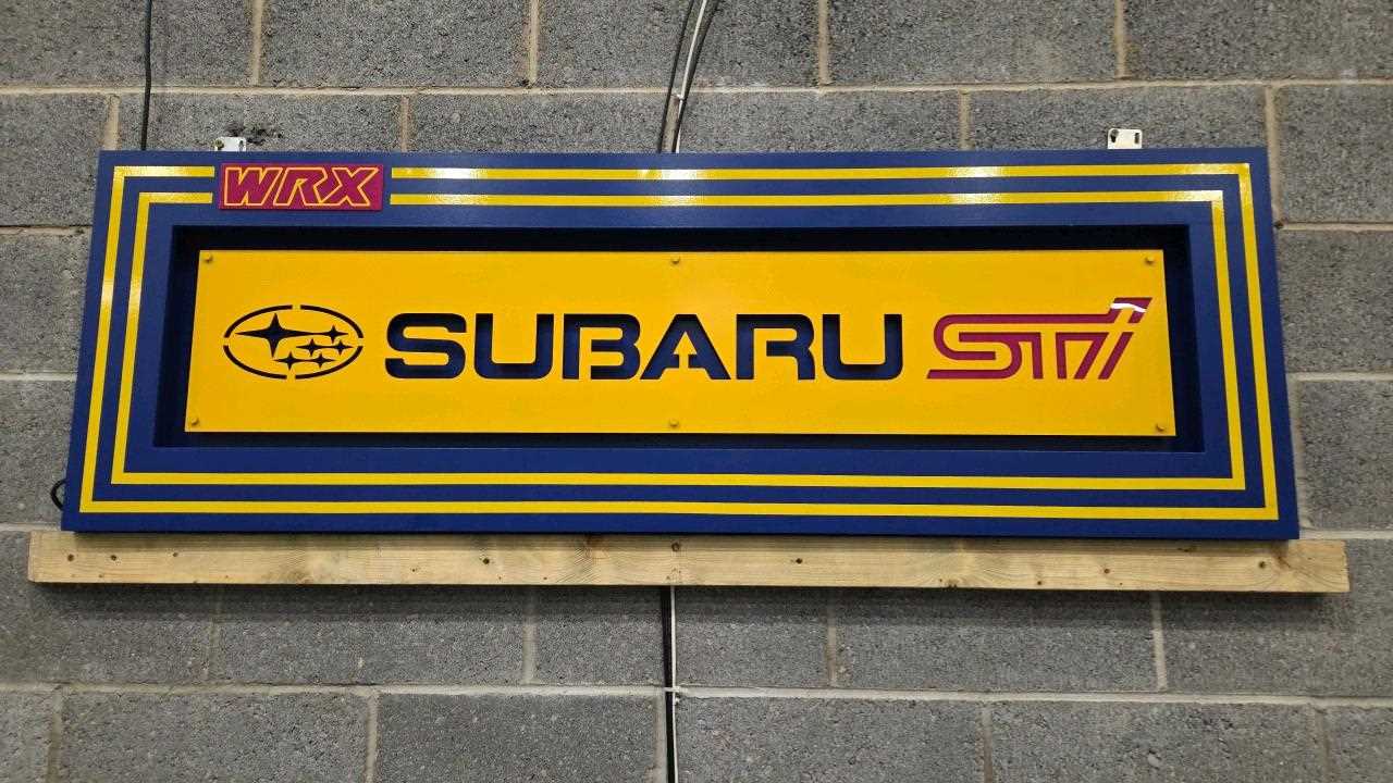 Lot 119 - HAND MADE WOODEN ILLUMINATED SUBARU SIGN 66